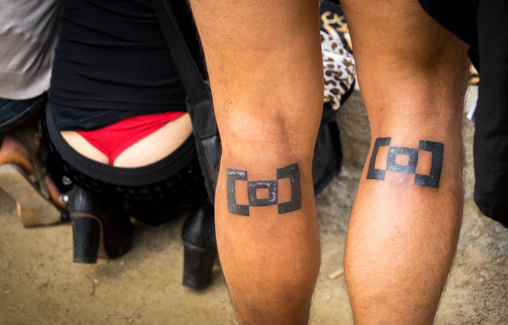 Woman wearing a thong and someone's legs