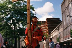 A Christian preacher holds a cross